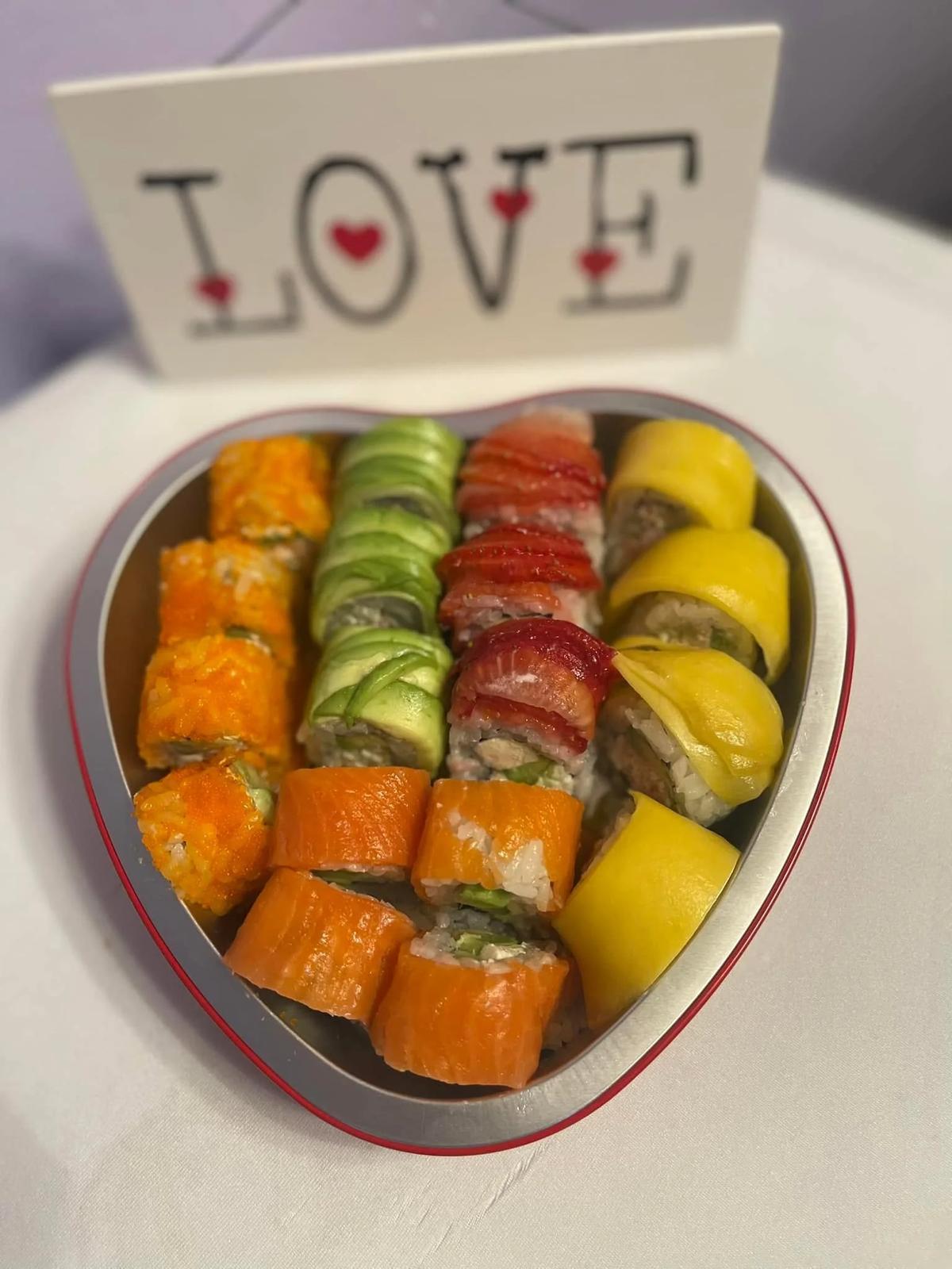 A heart-shaped box of sushi rolls