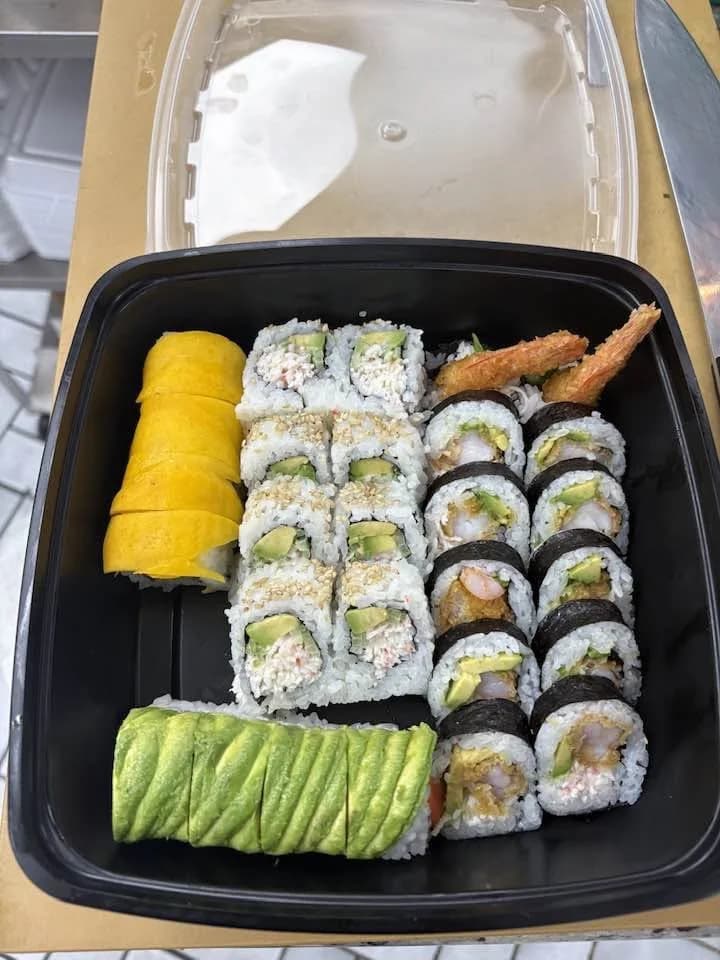 A box of assorted sushi rolls